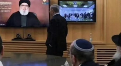 صورة مُركبة قيل إنها أثناء متابعة نتنياهو لخطاب حسن نصر الله